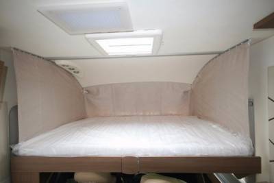 Lounge space|Drop down bed|Washroom with wetroom swivel feature|Swivel pilot seats|Kitchen with gloss cabinets|Rear facing habitation|Island bed|Kitchen with soft close drawers||||