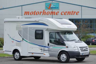 Chausson Flash 2013|Chausson External|Large wrap around lounge|Habitation rear facing|Electronic bed at fixed bed height|Suede lounge and skylight|Dining and sleeping quarters|Kitchen with microwave|Full width washroom|Height adjustable electric bed|